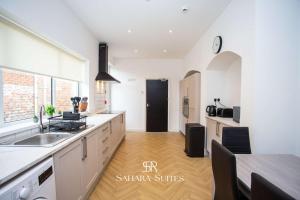 a kitchen with a sink and a counter top at Luxury 6BR Ensuite - Contractors & Groups Stay - Parking in Sunderland