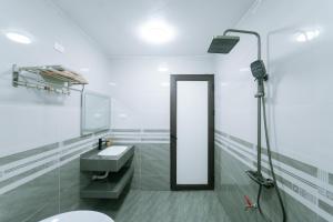 a bathroom with a sink and a mirror at Đồi Bông Village in Mục Uyên +30 photos