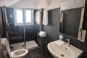 a bathroom with a sink and a toilet and a shower at B&B Osteria Morganti in Someo +69 photos