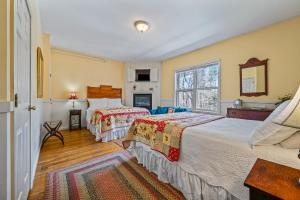 a bedroom with two beds and a window at Inn at Jackson in Jackson