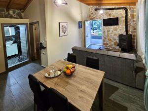 a living room with a table and a couch at Elia Paradise Villa with private Pool in Heraklio