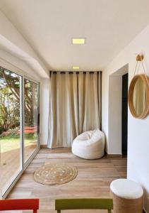 a room with a bean bag chair and a window at Seaside Apartment in Conca