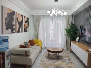 a living room with a couch and a table at Imani Homes in Nairobi