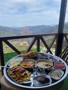 a tray of food on top of a table at Pisa Villa-Bungalov in Topluca +10 photos
