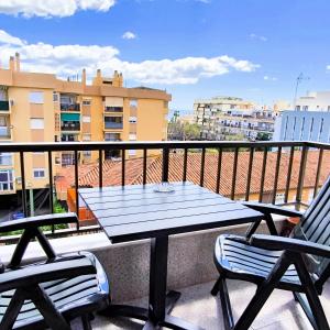 a table and two chairs on a balcony at ApartRincón Candelaria in Rincón de la Victoria