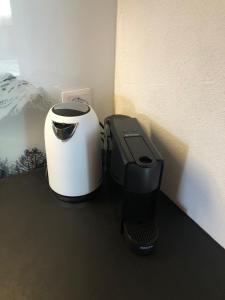 two printers sitting on a counter next to a wall at Chalet Alpen Charme in Turtmann +1 photo