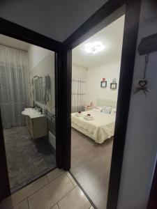 a bedroom with a bed and a sink and a mirror at Appartamento Natalia Verona in Verona +53 photos