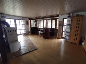 a living room with a couch and a refrigerator at Schöner Wohnen in Rheinau +21 photos