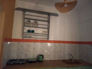 a kitchen with a sink and a counter top at Sunshine in Maltezana +81 photos
