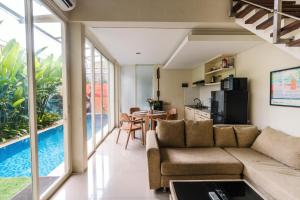 a living room with a couch and a table at Modern Villa near Seminyak & Canggu, Large Pool in Kerobokan