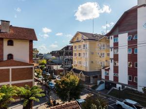 an aerial view of a city with buildings at Apto bem no Centro 2 dorm by Achei Gramado in Gramado