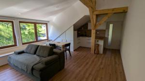 a living room with a couch and a table at Apartmaji Pippi in Bovec