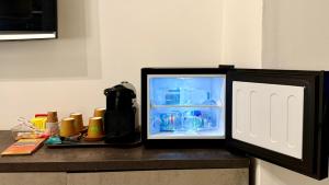 a small refrigerator sitting on top of a counter at Urban & B in Civitavecchia