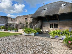 a house with a stone driveway in front of it at The Nest in Kingsbridge +24 photos