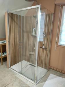 a shower with a glass door in a bathroom at Chez YEP, 4 chambres 9 couchages in Anzin-Saint-Aubin