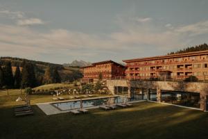 a rendering of a building with a large yard at Sporthotel Floralpina in Alpe di Siusi