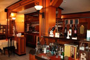 a bar with a lot of bottles of wine at Restaurant Orakel in Oberstenfeld