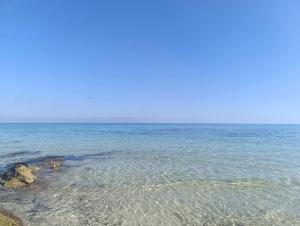 a large body of water with rocks in it at Maison à louer in Chebba