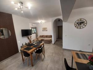 a living room with a table and a couch at Velania House 2 in Filótion