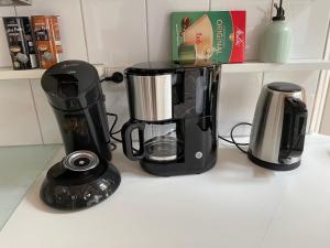 a black coffee maker on a kitchen counter at Landidyll Engelhofen in Obersontheim