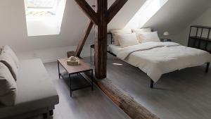 a bedroom with two beds in a attic at Dvorek110 in Roudnice nad Labem