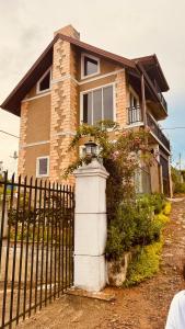 a house with a fence in front of it at Misty5 in Pattipola