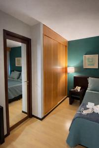 a bedroom with a bed and a door to a room at Flat Vila Olimpia Hotel Experience in São Paulo +23 photos
