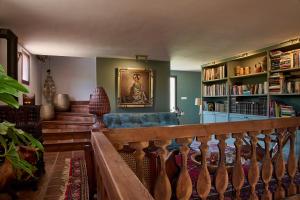 a living room with a couch and a book shelf at Villa Camilla in Comares