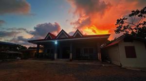 a house on fire with a fire in the sky at Pineda Villa in Puerto Princesa City