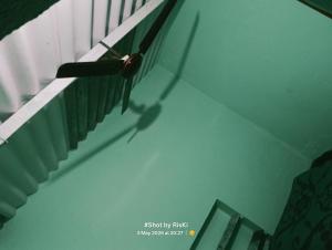 a shadow of a person on a stair case at Quarter 2355 in Bokāro