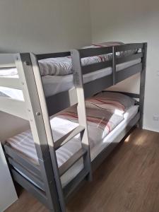 a couple of bunk beds in a room at Ferienwohnung Bever in Bad Karlshafen