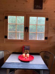 a table in a cabin with two candles on it at Cozy Woodland Bunkie Outdoor Shower WiFi in Simcoe +73 photos