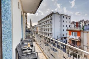 a balcony with a view of a city at Pompei Luxury Suites-Near Ruins in Pompei