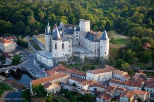 an aerial view of a castle in a town at LIntemporel in Saint-Sornin