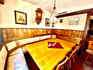 a wooden table with a napkin on top of it at Gasthaus Goldener Anker in Gemünden