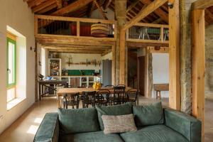 a living room with a couch and a table at Borda Viñuels in Planillo