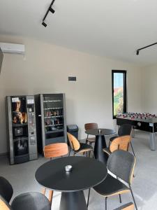 a room with two tables and a pool table at Conty in Vršac