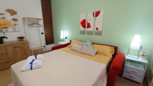 a bedroom with a bed and a mirror at Sweet Simo House in Azzate