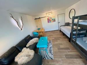 a living room with a couch and bunk beds at Maria Altreichenau in Neureichenau
