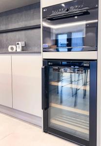 a black and white oven in a kitchen at Stay in MooD in Busan