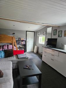 a living room with a couch and a table at Klevenius in Gnesta