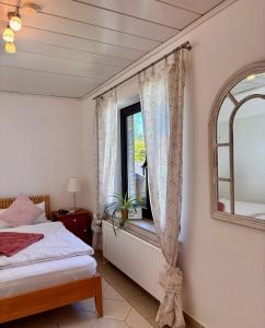 a bedroom with a bed and a window at Hamburg Living Hub in Pinneberg