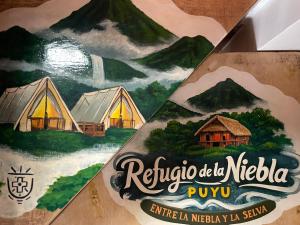 a sign for a resort in the mountains at Refugio de la niebla puyo glamping in Puyo