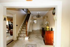 a hallway of a home with a staircase and a stair case at Laurel Lodge in Virginia