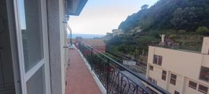 a balcony with a view of a mountain at Penthouse in the historical center with sea view 5 minutes away,400mt, from main square in Amalfi