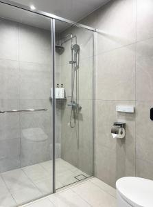 a shower with a glass door in a bathroom at Stay in MooD in Busan +40 photos