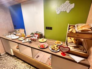 a bakery counter with bread and food on it at Chata POD HOUBOVÝM VRCHEM in Horní Planá