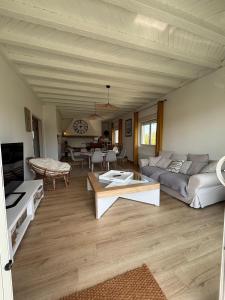 a living room with a couch and a table at Appartement Bassin d' Arcachon in La Teste-de-Buch