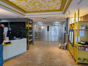 a lobby of a store with a ceiling at Le Jourdain in Paris
