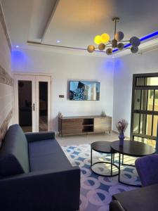 a living room with a couch and a table at Welcome Home202 Saint-Louis in Saint-Louis